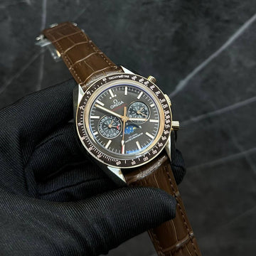 Omega speed master rose gold in black moon phase
