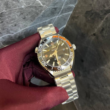 Omega semester black in orange steel strap