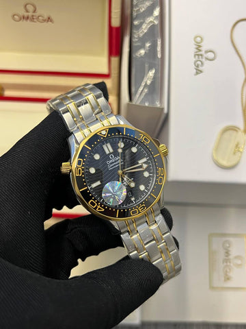 Omega semaster black in gold steel strap