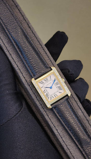 Cartier tank white in gold in diamond black strap