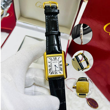Cartier tank white in gold leather strap