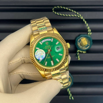 Rolex day date green in gold strap