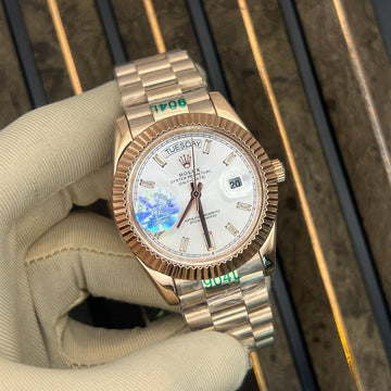 Rolex day date white dial in rose gold strap