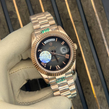Rolex day date black dial in rose gold strap roman dial