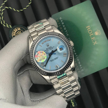 Rolex day date sky blue in silver strap roman dial