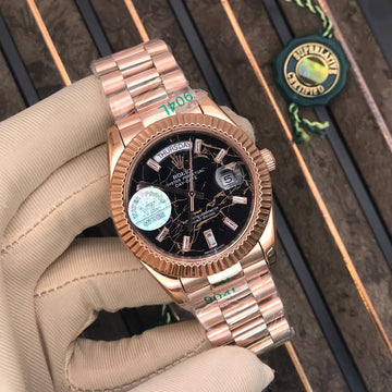 Rolex day date black in rose gold strap