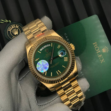Rolex day date green in gold roman dial