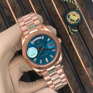 Rolex day date blue in rose gold