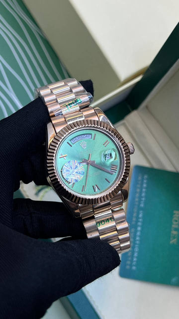 Rolex day date green in rose gold strap roman dial