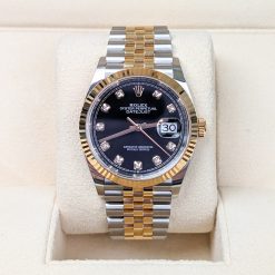 Rolex 126233 Datejust 36mm, fluted bezel, black diamond dial, Jubilee bracelet.